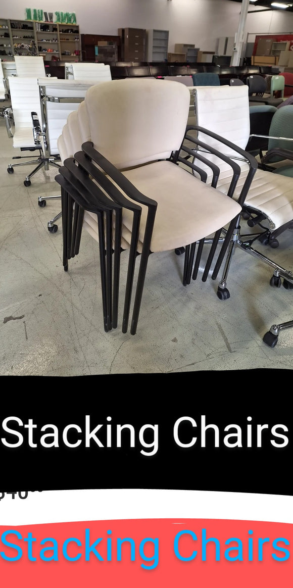 Stacking Chairs- The seat is In the color Cream white. With the arms and legs in the color Black- each unit sold separately 